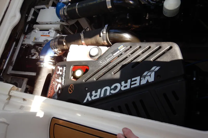 Slide: The Image of Engine compartment of a 2007 Cruisers 340 Express with Mercury engine components. - 44
