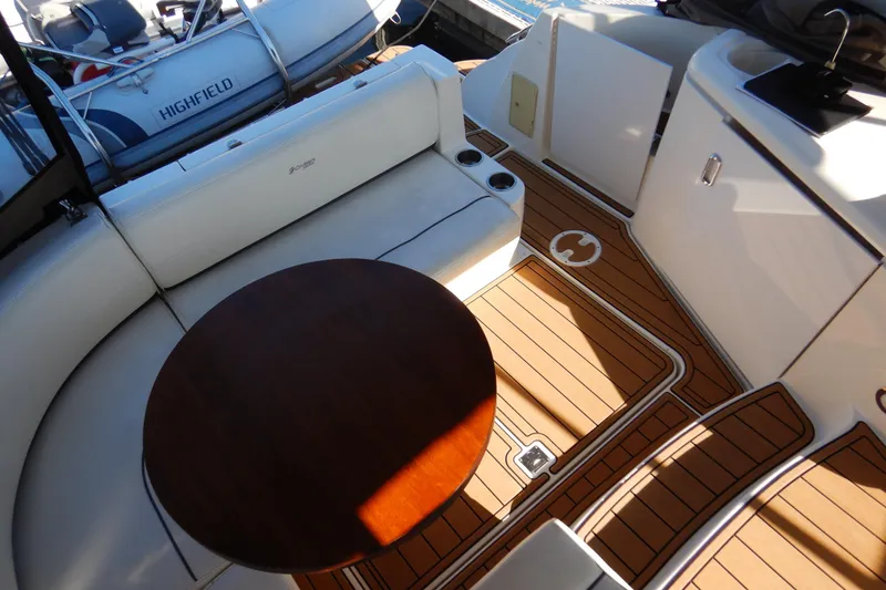 Slide: The Image of Open storage compartment on 2007 Cruisers 340 Express boat with coiled hoses and equipment. - 6