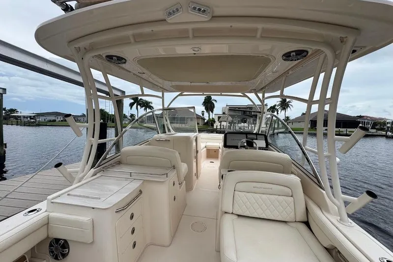 Slide: The Image of 2020 Grady-White Freedom 285 boat interior, featuring spacious seating and modern amenities. - 16