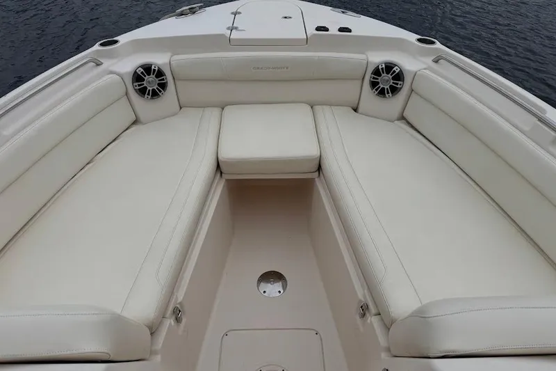 Slide: The Image of 2020 Grady-White Freedom 285 boat interior with white cushioned seating. - 18