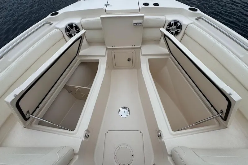 Slide: The Image of 2020 Grady-White Freedom 285 boat interior with open storage compartments. - 21