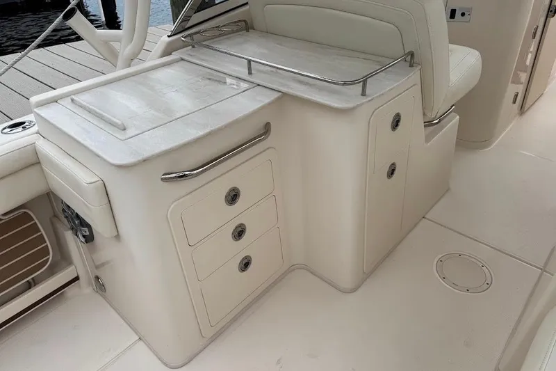 Slide: The Image of 2020 Grady-White Freedom 285 boat interior with storage compartments and seating. - 27