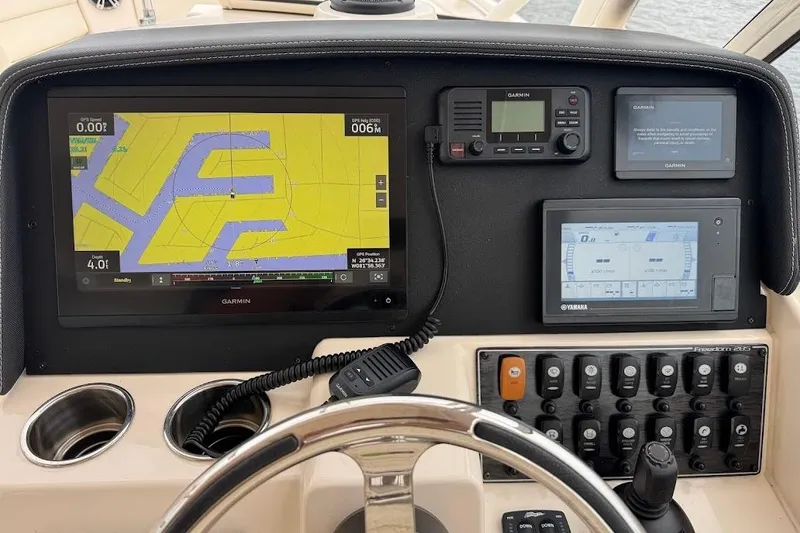 Slide: The Image of 2020 Grady-White Freedom 285 dashboard with Garmin navigation and Yamaha controls. - 33