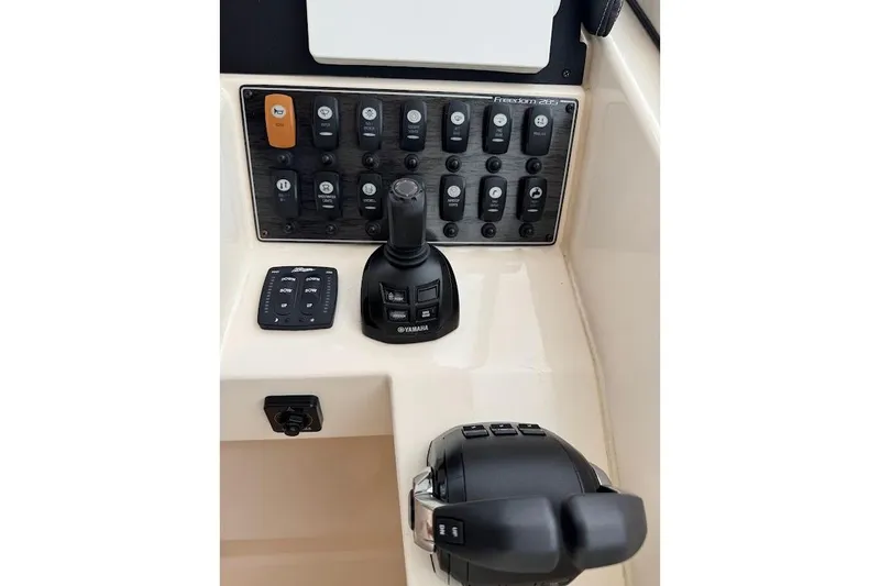 Slide: The Image of Control panel of 2020 Grady-White Freedom 285 boat with Yamaha joystick and switches. - 34