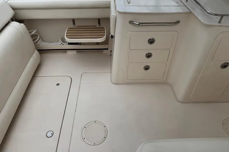 Slide: The Image of 2020 Grady-White Freedom 285 boat interior with storage compartments and seating. - 40