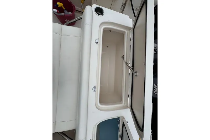 Slide: The Image of 2020 Grady-White Freedom 285 boat storage compartment open, showcasing interior space. - 42