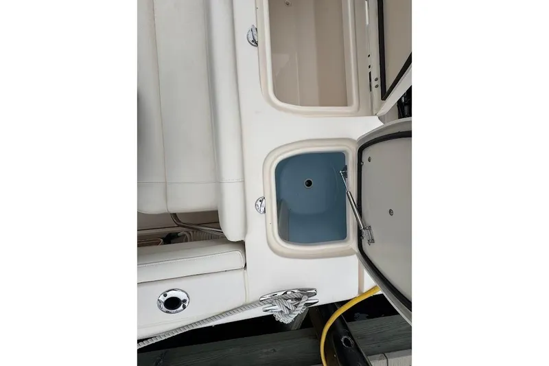 Slide: The Image of 2020 Grady-White Freedom 285 boat interior with open storage compartments. - 43