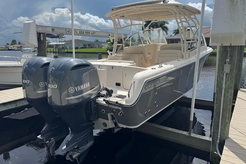 Slide: The Image of 2020 Grady-White Freedom 285 boat with twin Yamaha 300 engines docked at marina. - 51