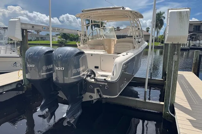Slide: The Image of 2020 Grady-White Freedom 285 boat with twin Yamaha 300 engines docked by waterfront. - 52