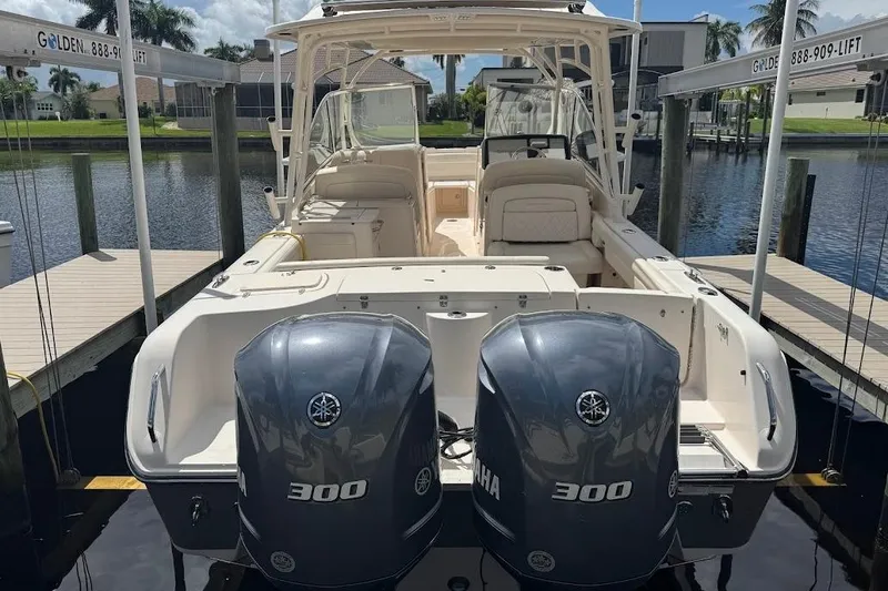 Slide: The Image of 2020 Grady-White Freedom 285 boat with dual Yamaha 300 engines docked. - 54