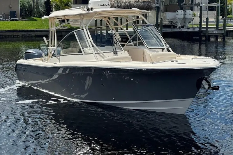 Slide: The Image of 2020 Grady-White Freedom 285 boat on calm water, featuring sleek design and modern amenities. - 6