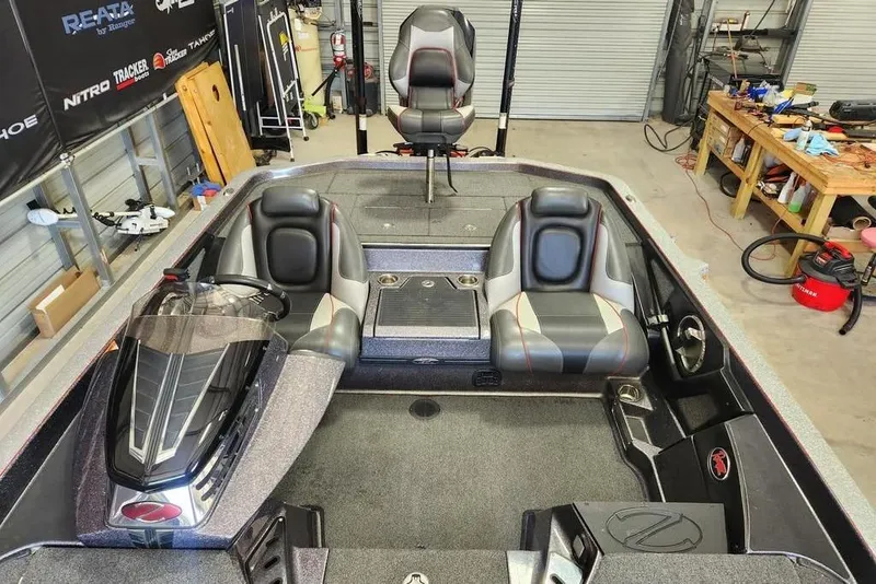 Slide: The Image of 2021 Ranger Z520C Ranger Cup Equipped boat interior in a workshop setting. - 4