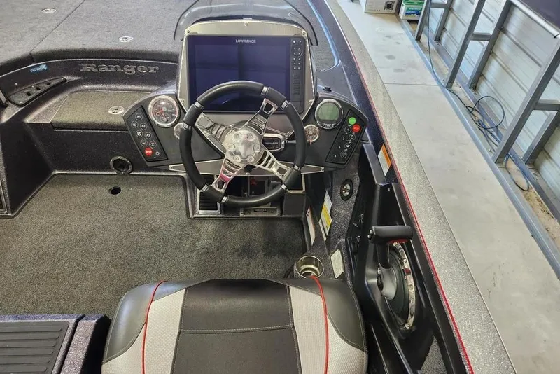 Slide: The Image of 2021 Ranger Z520C Ranger Cup boat cockpit with steering wheel and control panel. - 8