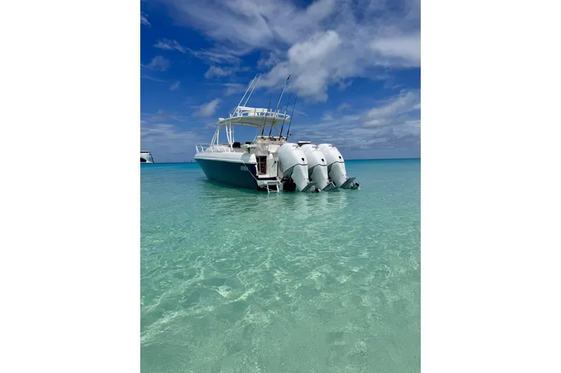 Slide: The Image of 2006 Intrepid 377 Walkaround boat in clear turquoise water under a blue sky. - 3