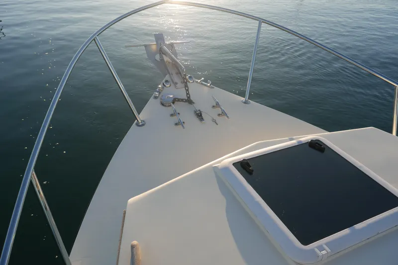 Slide: The Image of Bow of 2023 Seaway 24 Seafarer boat on calm water at sunset. - 20