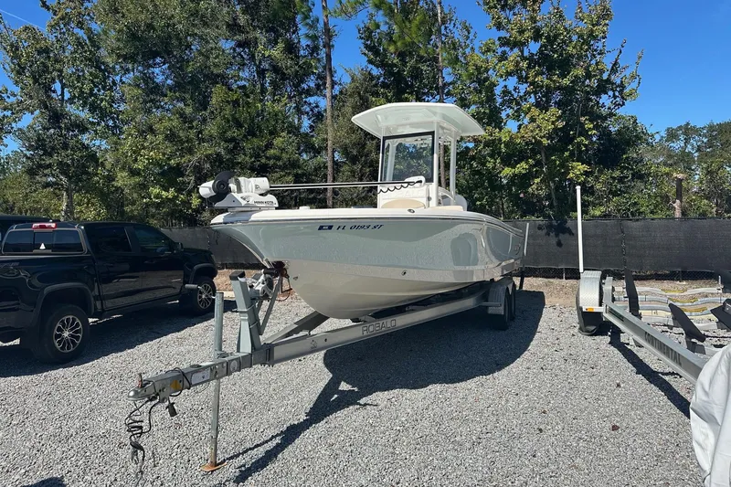 The Image of 2020 Robalo 246 Cayman boat on trailer in outdoor setting. - 0