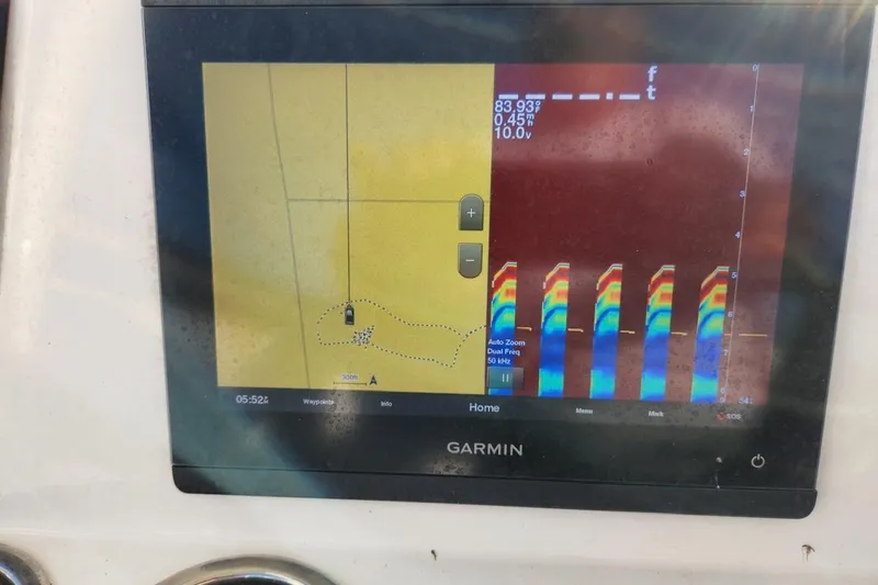 Slide: The Image of Garmin fishfinder display on 2020 Robalo 246 Cayman boat, showing sonar and navigation data. - 12