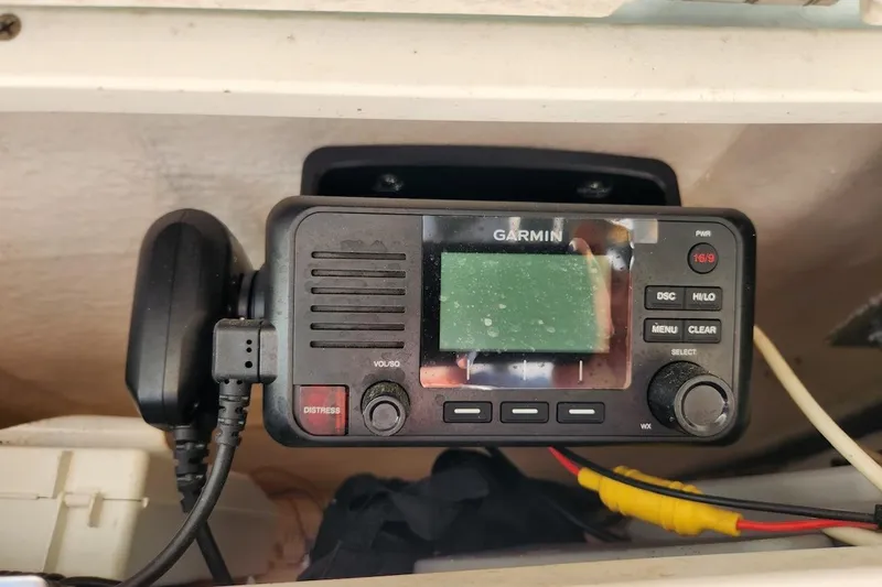 Slide: The Image of Garmin marine radio installed on a 2020 Robalo 246 Cayman boat dashboard. - 14
