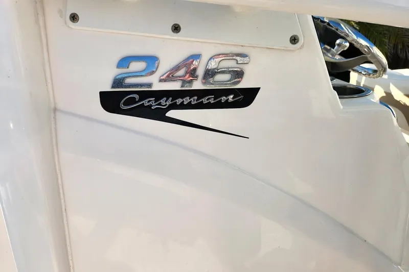 Slide: The Image of 2020 Robalo 246 Cayman boat logo on white surface. - 21