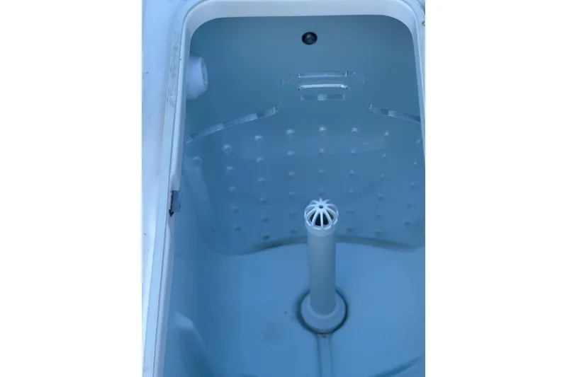 Slide: The Image of 2020 Robalo 246 Cayman livewell interior with aeration system. - 22