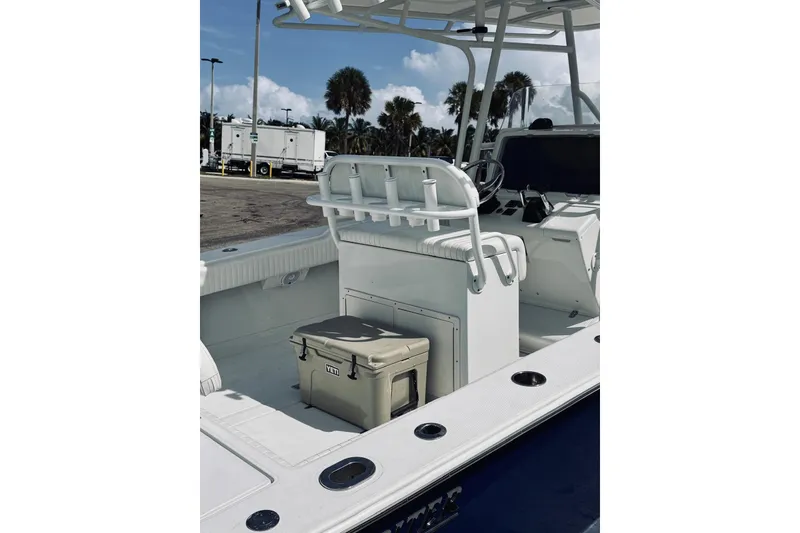 Slide: The Image of 2005 Jupiter 31 boat interior with seating and Yeti cooler on deck. - 19