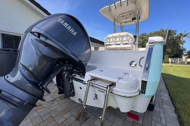 Slide: The Image of 2022 Robalo R230 Center Console boat with Yamaha outboard engine on a sunny day. - 10