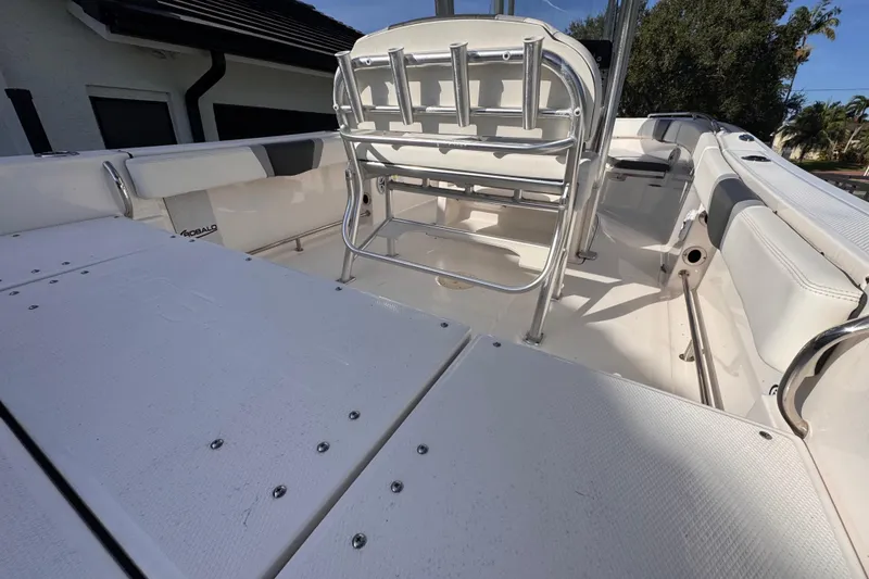 Slide: The Image of 2022 Robalo R230 Center Console boat interior with seating and storage. - 19