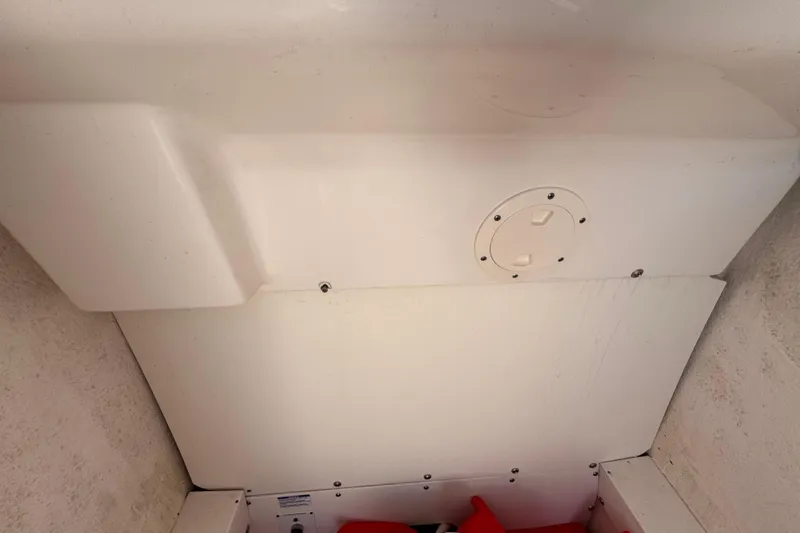 Slide: The Image of Interior view of 2022 Robalo R230 Center Console boat compartment. - 28