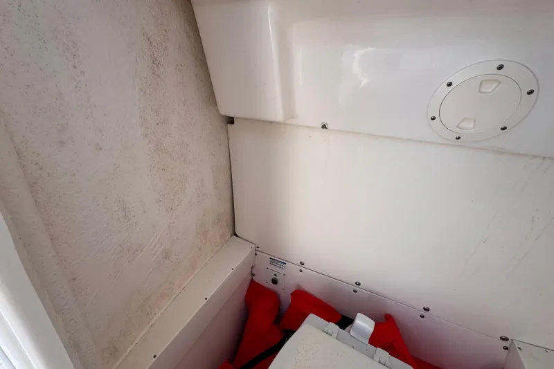 Slide: The Image of Interior view of a 2022 Robalo R230 Center Console boat storage compartment. - 29