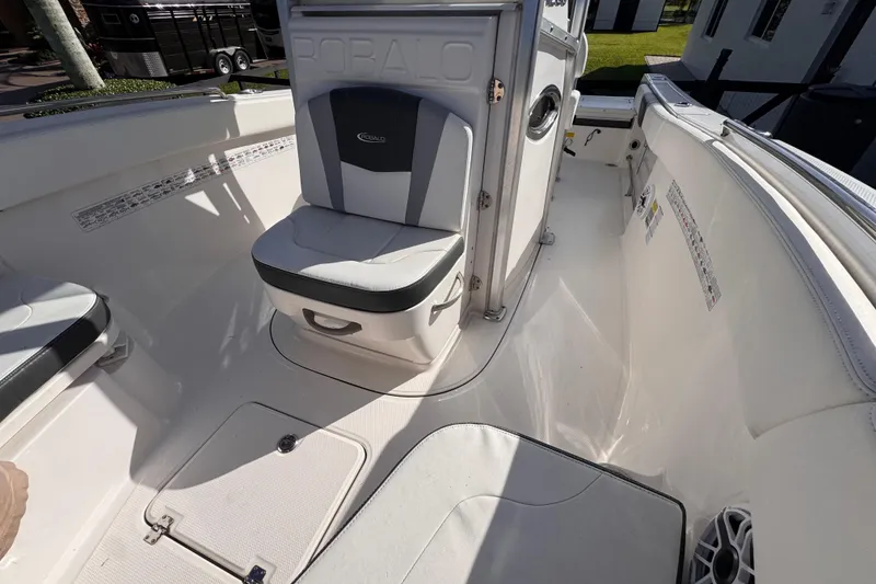 Slide: The Image of 2022 Robalo R230 Center Console boat interior with seating and storage compartments. - 33