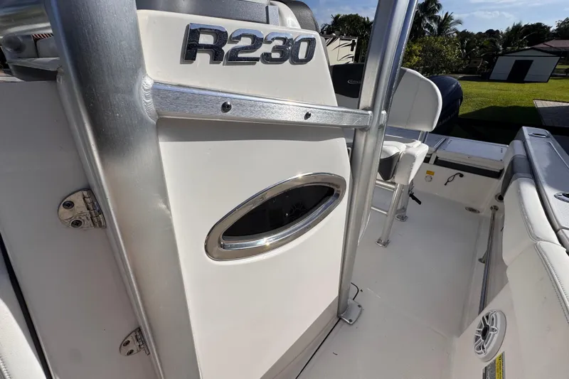 Slide: The Image of 2022 Robalo R230 Center Console boat interior with seating and console details. - 34