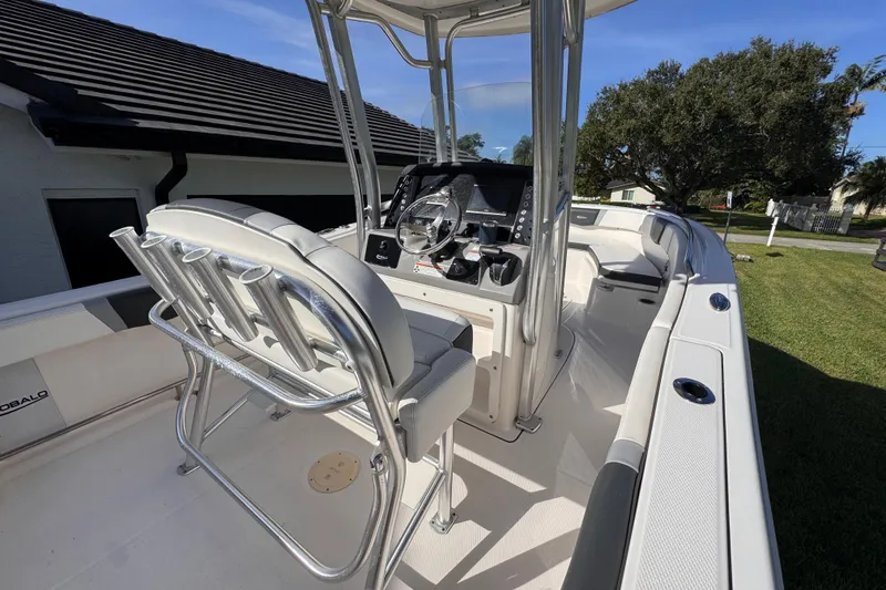 Slide: The Image of 2022 Robalo R230 Center Console boat with sleek design and modern controls. - 43