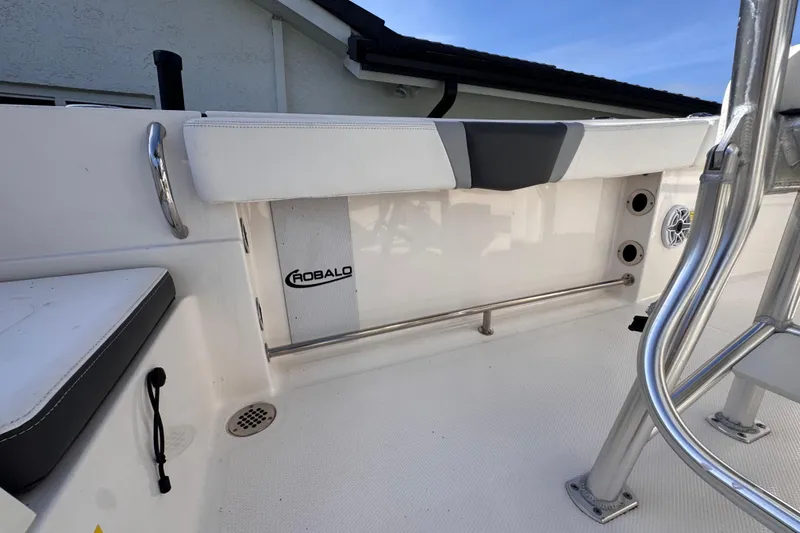 Slide: The Image of 2022 Robalo R230 Center Console boat interior with seating and stainless steel features. - 47