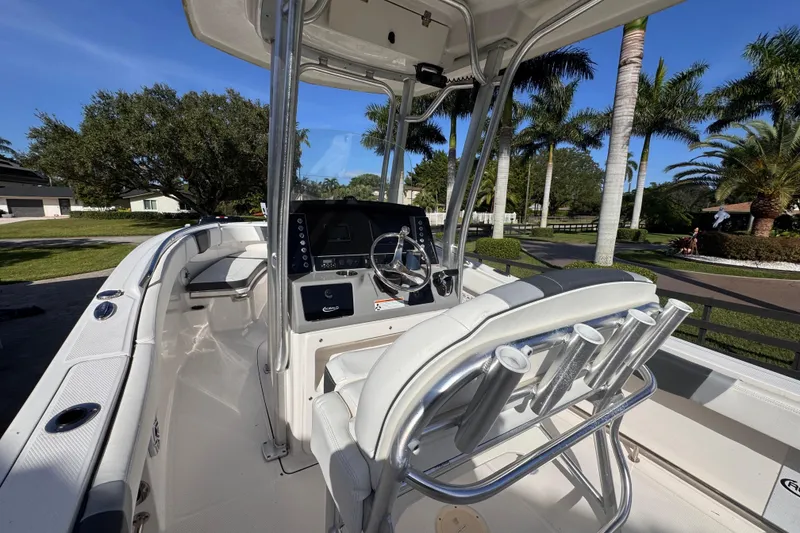 Slide: The Image of 2022 Robalo R230 Center Console boat with sleek design and modern controls. - 52