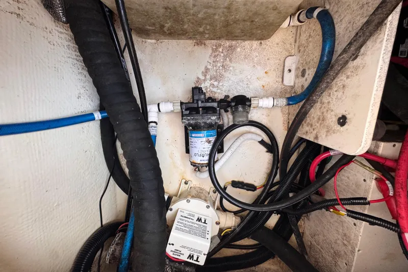 Slide: The Image of 2022 Robalo R230 Center Console boat wiring and plumbing system close-up. - 53