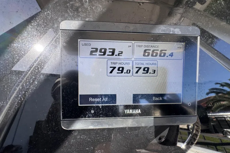 Slide: The Image of Yamaha display on 2022 Robalo R230 Center Console showing fuel and trip data. - 56