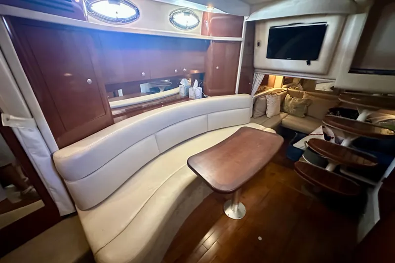 Slide: The Image of Luxurious interior of 2008 Sea Ray 340 Sundancer yacht with elegant seating and wooden accents. - 11