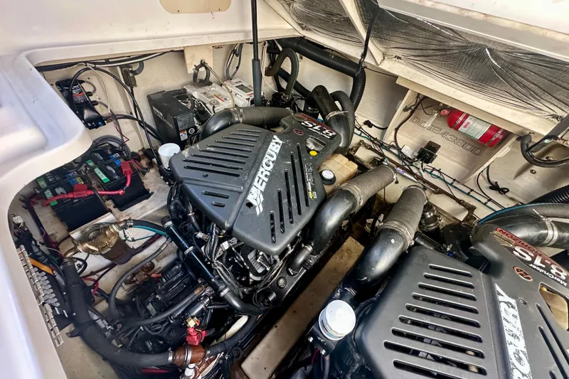 Slide: The Image of Engine compartment of a 2008 Sea Ray 340 Sundancer with Mercury engines. - 16