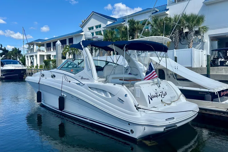 Slide: The Image of 2008 Sea Ray 340 Sundancer yacht docked at marina with American flag. - 3