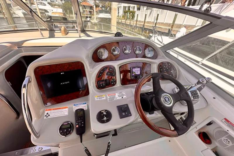 Slide: The Image of Helm of 2008 Sea Ray 340 Sundancer with modern controls and navigation system. - 8