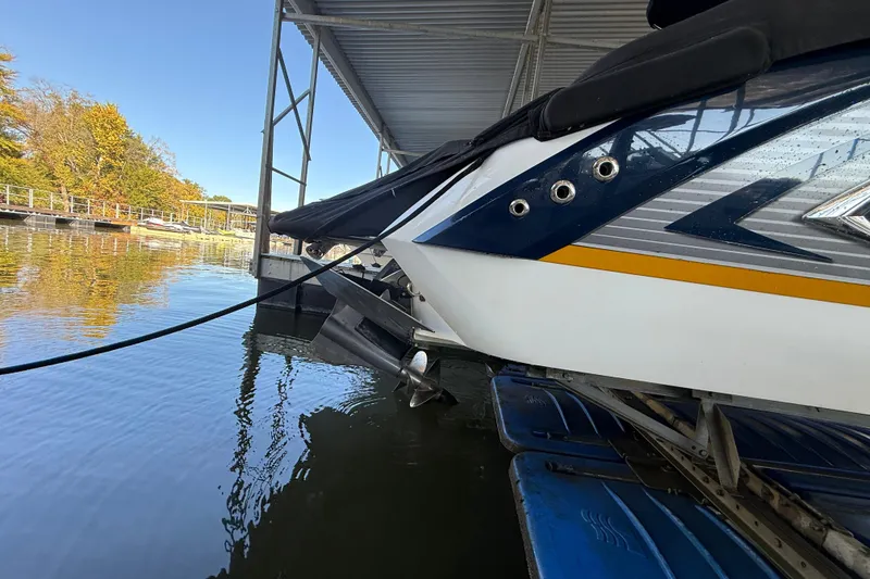 Slide: The Image of 2018 Cobalt R3 Surf boat docked, showcasing sleek design and vibrant colors. - 14