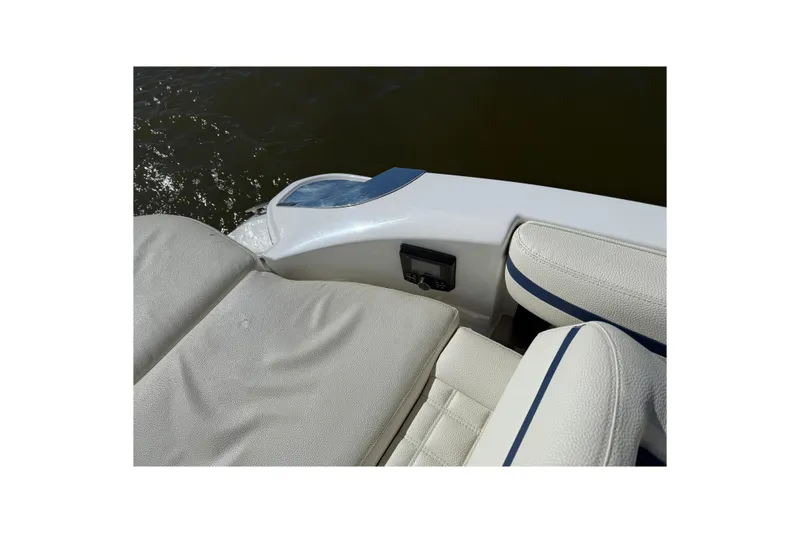 Slide: The Image of 2018 Cobalt R3 Surf boat interior with white leather seats and water view. - 5