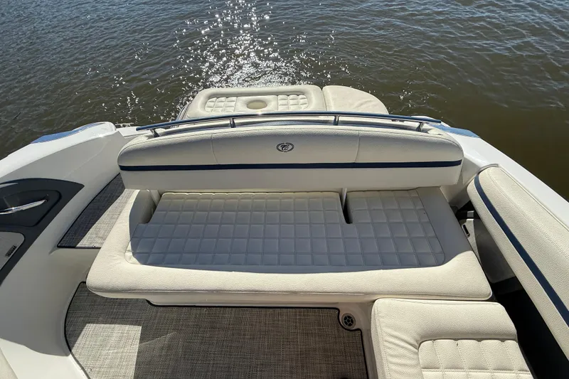 Slide: The Image of 2018 Cobalt R3 Surf boat interior with cushioned seating, overlooking water. - 7