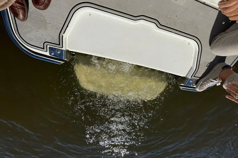 Slide: The Image of 2018 Cobalt R3 Surf boat platform with water splashing below. - 9