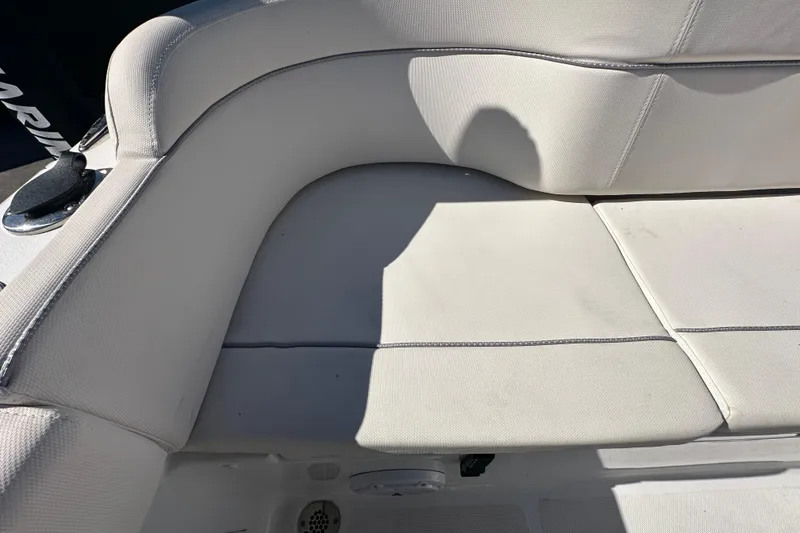 Slide: The Image of 2024 Sea Hunt Ultra 219 boat seat with light gray upholstery. - 24