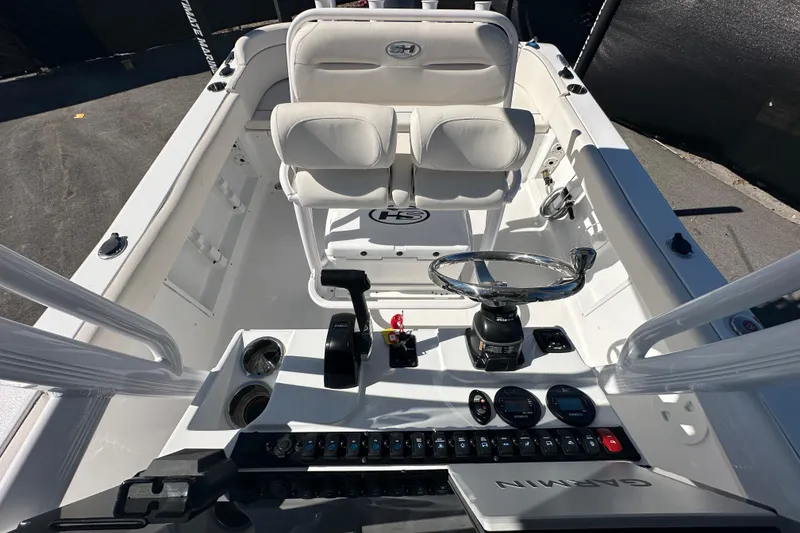 Slide: The Image of 2024 Sea Hunt Ultra 219 boat interior with steering wheel and controls. - 30