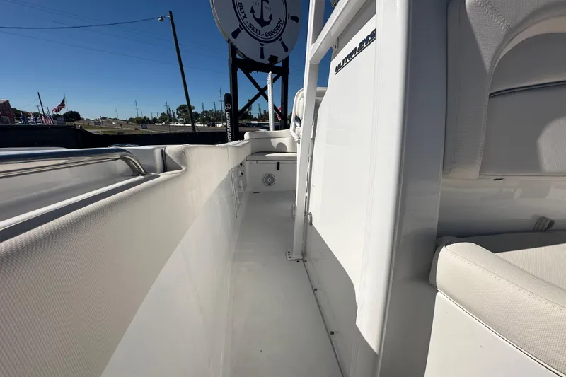 Slide: The Image of 2024 Sea Hunt Ultra 219 boat interior, showcasing sleek white seating and spacious design. - 35