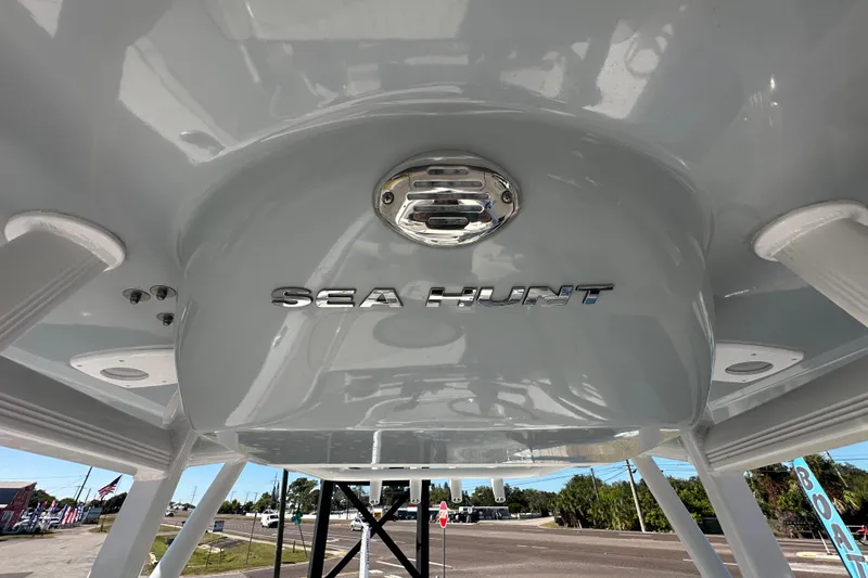 Slide: The Image of 2024 Sea Hunt Ultra 219 boat canopy with logo, viewed from below. - 37