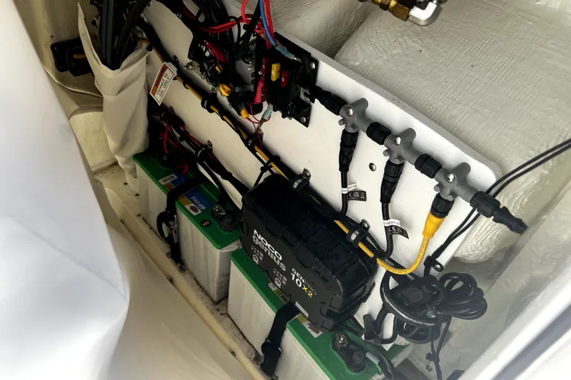 Slide: The Image of 2024 Sea Hunt Ultra 219 boat electrical system with batteries and wiring. - 4