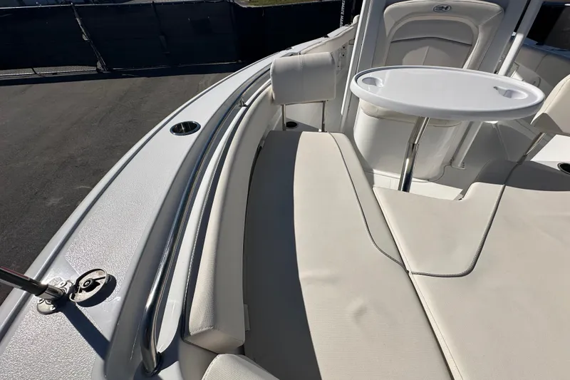 Slide: The Image of 2024 Sea Hunt Ultra 219 boat interior with seating and table. - 40